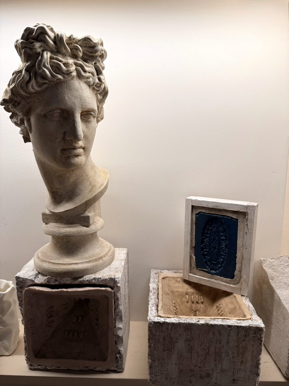 Plaster bust and casting moulds in a workshop