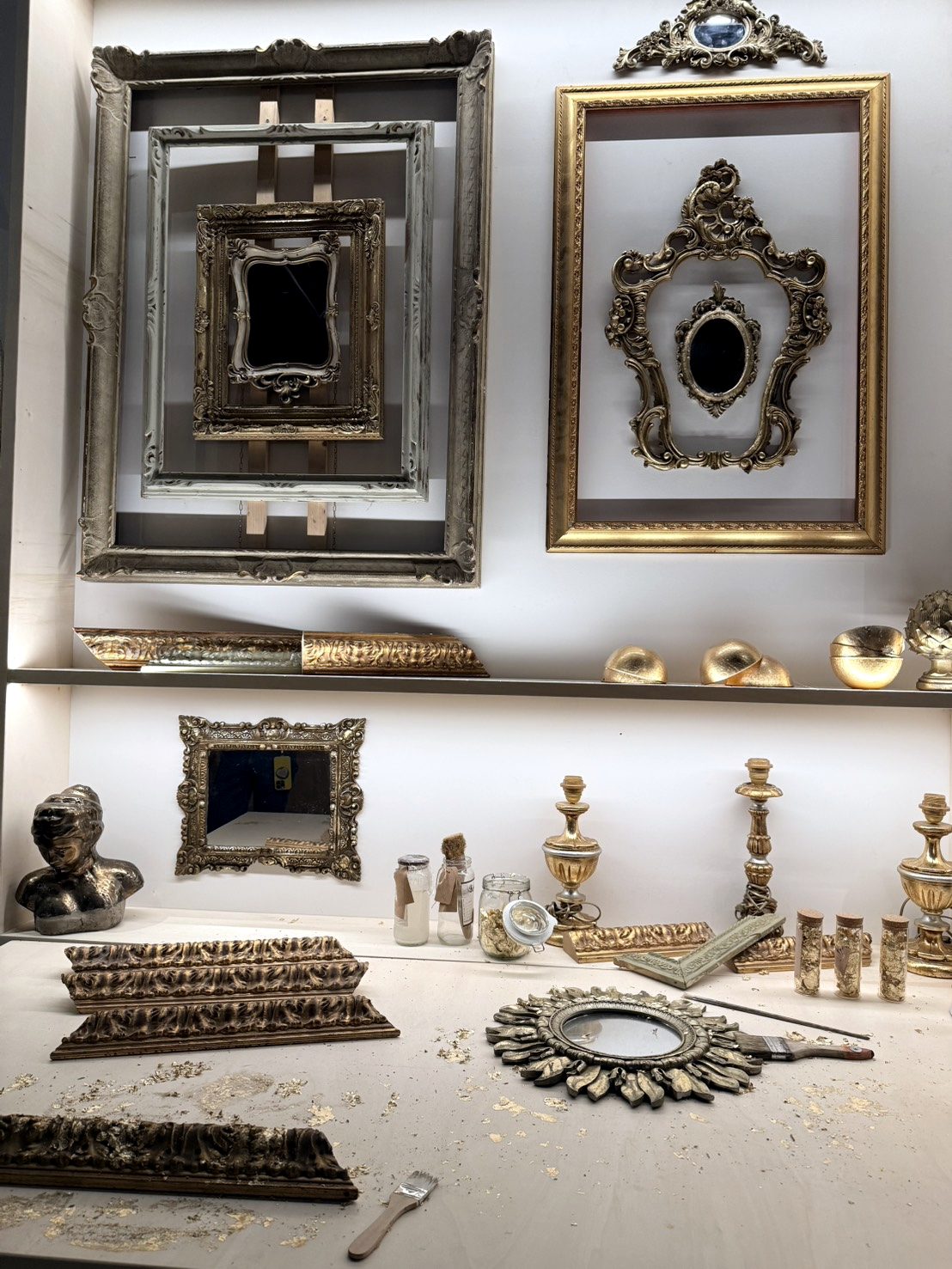 Gilded frames and mirrors in a gilding workshop